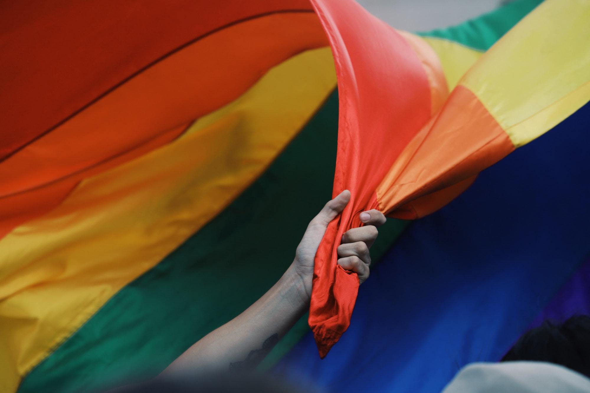WMC F Bomb LGBTQ pride flag Jose Pablo Garcia Unsplash 6520