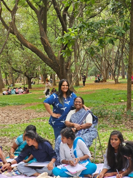 Wmc features Priyanka Samy standing with her mother Dalit feminist activist Ruth Manorama seated during an NFDW event 042226